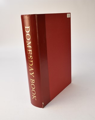 Lot 1116 - DOMESDAY BOOK OF BERKSHIRE. Alec. Historical Editions, 1988. Folio, includes facsimile, studies and translation. 3 vols in drop-back box. Quarter faux red leather, small split at base of spine.