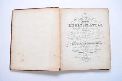 Lot 1163 - SMITH, Charles. Smith's New English Atlas containing a complete set of county maps. 4to 1828. With a map of England and Wales and 42 county maps. Outline hand colour. Half calf, boards detached.