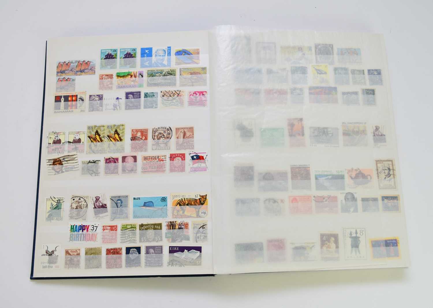 Lot 255 - World mix of stamps in blue SG stockbook
