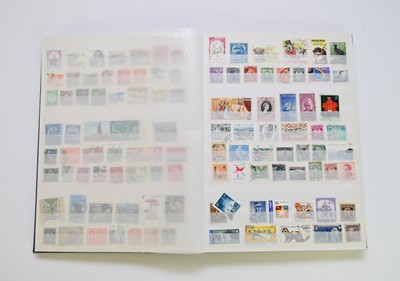 Lot 255 - World mix of stamps in blue SG stockbook