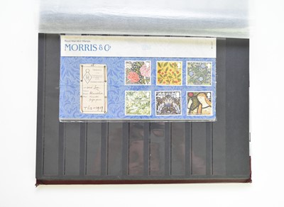 Lot 258 - Burgundy album containing mint and used GB plus some Commonwealth stamps