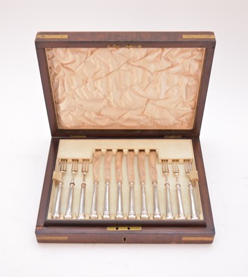 Lot 52 - An early 20th century cased set of silver dessert knives and forks