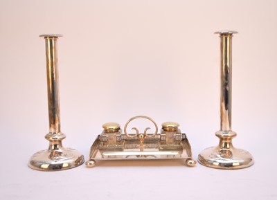 Lot 15 - A plated ink stand and a pair of plated candlesticks