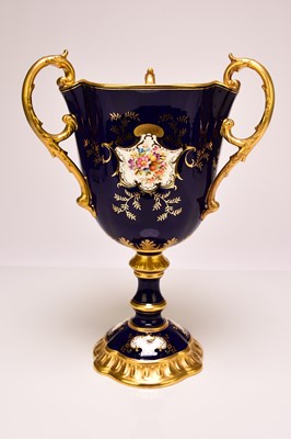 Lot 197 - A Coalport trophy vase painted with birds, fruit, flowers and insects, early 20th century