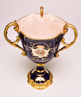 Lot 197 - A Coalport trophy vase painted with birds, fruit, flowers and insects, early 20th century