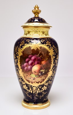 Lot 233 - A Coalport vase and cover painted with fruit by Chivers, circa 1920s