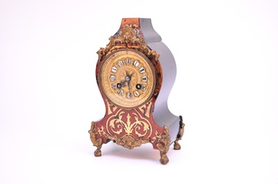 Lot 615 - A French Louis VX style boulle mantel clock