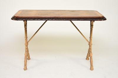 Lot 466 - A Coalbrookdale cast iron table with walnut top