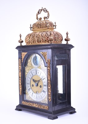 Lot 320 - A fine and rare early 18th century ebonised quarter repeating double basket top bracket clock