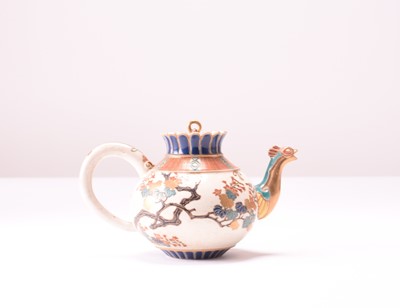 Lot 110 - A Japanese Satsuma earthenware teapot and cover, Meiji era