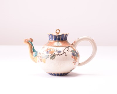 Lot 110 - A Japanese Satsuma earthenware teapot and cover, Meiji era