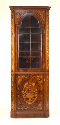 Lot 197 - A reproduction Dutch marquetry standing corner cabinet