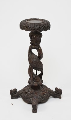 Lot 128 - A Burmese carved hardwood torchere or vase stand, 19th century