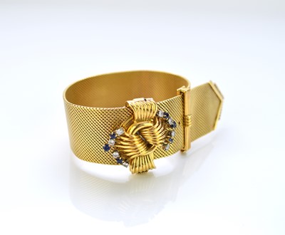 Lot 34 - An 18ct gold sapphire and diamond stylised buckle bracelet set with EMKA watch