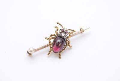 Lot 188 - A cabochon garnet, rose cut diamond and single untested pearl Beetle bar brooch