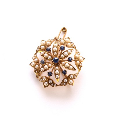 Lot 187 - An untested sapphire and split seed pearl set openwork floral brooch