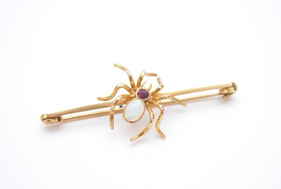 Lot 112 - An opal and ruby spider bar brooch