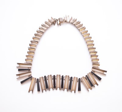 Lot 260 - A white metal and black enamel graduated geometric inspired fringe necklace