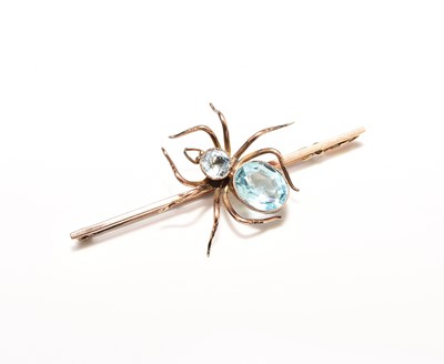 Lot 273 - A blue paste and aquamarine set spider brooch