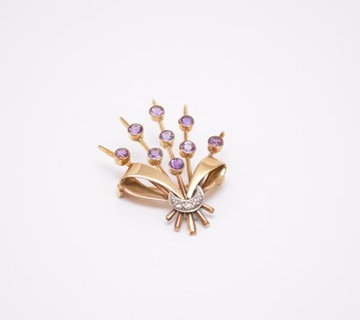 Lot 97 - An amethyst and diamond stylised bouquet brooch