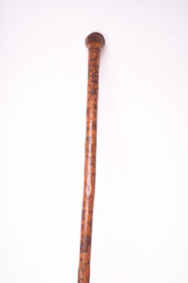 Lot 568 - A 19th century incised cane