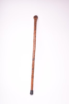 Lot 568 - A 19th century incised cane