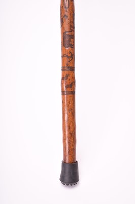 Lot 568 - A 19th century incised cane