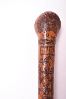 Lot 568 - A 19th century incised cane
