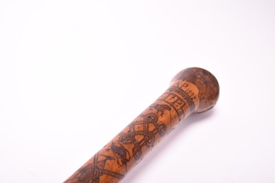 Lot 568 - A 19th century incised cane