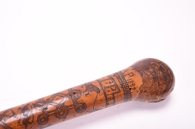 Lot 568 - A 19th century incised cane