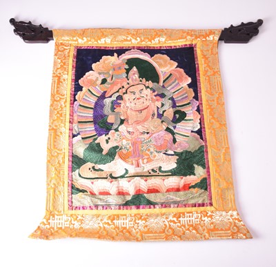 Lot 125 - A Tibetan embroidered thangka and a lacquered low altar table