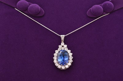 Lot 41 - A tanzanite and diamond pendant on chain