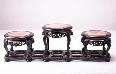 Lot 73 - A Chinese carved hongmu and pink marble triple vase stand, Qing Dynasty