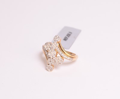 Lot 83 - A 9ct gold diamond crossover ring