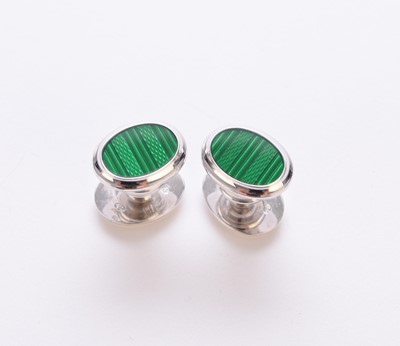 Lot 118 - A pair of Dunhill silver and green enamel cufflinks