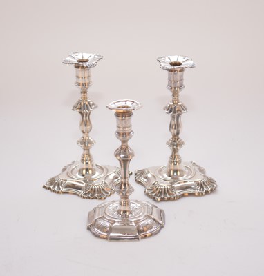 Lot 10 - A pair of George II style silver tapersticks