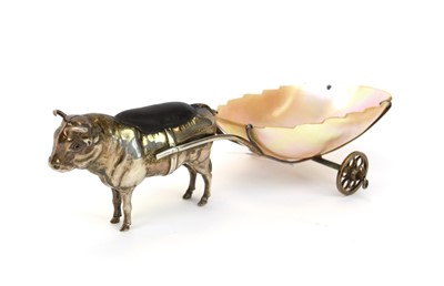 Lot 41 - An Edwardian novelty silver pin cushion in the form of a bull with a mother of pearl cart