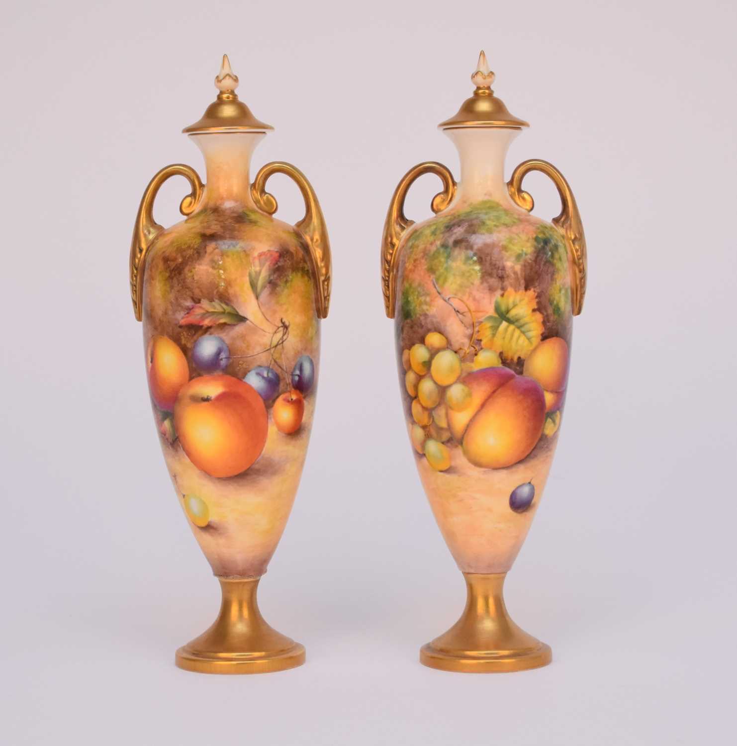 Lot 259 - A pair of Royal Worcester vases and covers painted with fruits by Telford