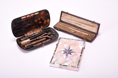 Lot 393 - A mother of pearl card case, tortoisheshell necessaire and a cased crochet hook