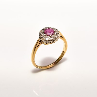 Lot 312 - An 18ct gold ruby and diamond floral cluster ring