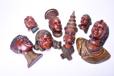 Lot 367 - A group of seven Achatit wall masks