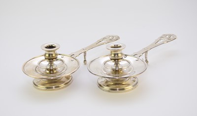 Lot 14 - A pair of Spanish white metal chambersticks