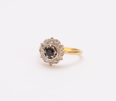 Lot 284 - An 18ct gold sapphire and diamond cluster ring