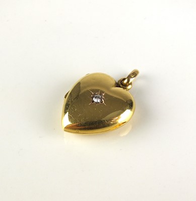 Lot 246 - An Edwardian 15ct gold diamond set heart shaped pendant on chain