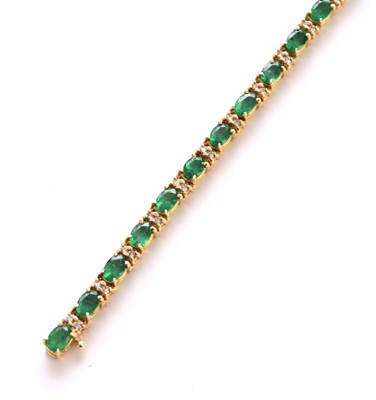 Lot 152 - A yellow metal emerald and diamond line bracelet