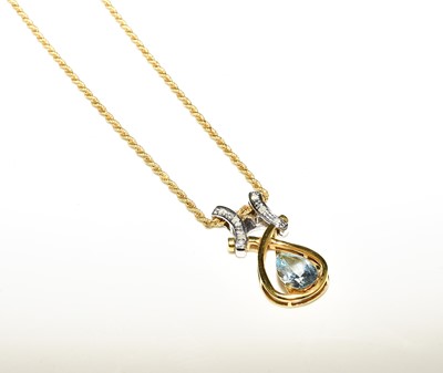 Lot 108 - A pear shaped blue topaz and diamond set pendant on chain