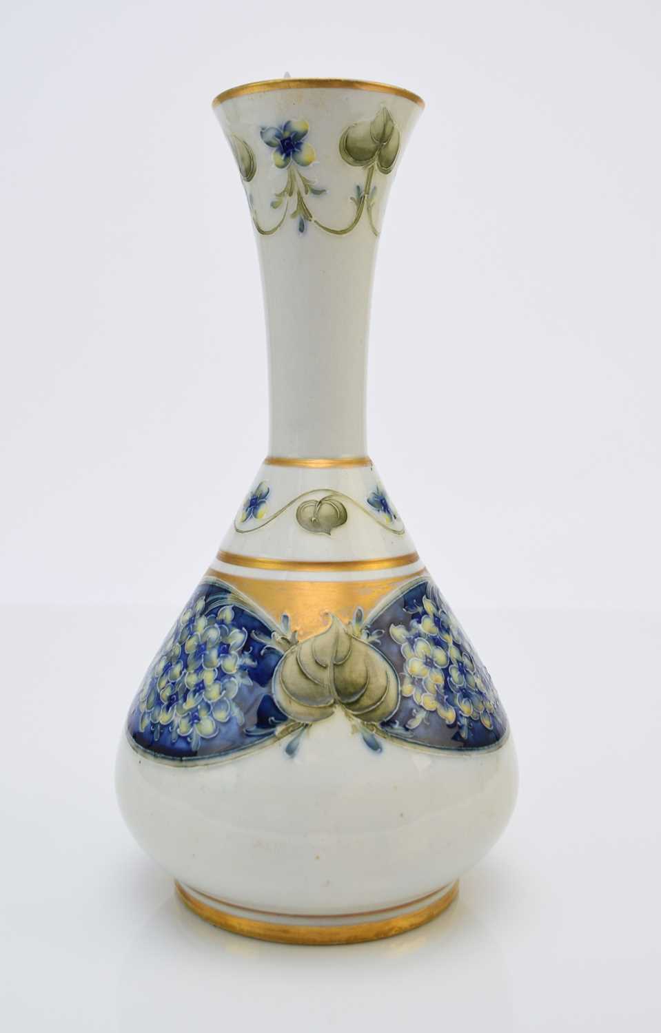 Lot 128 - William Moorcroft for Macintyre 'Lilac' florian vase, circa 1905