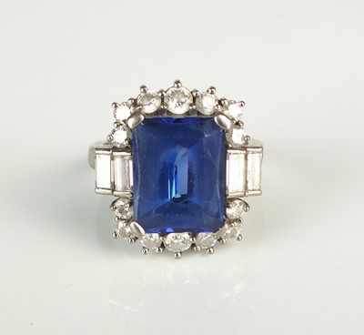 Lot 99 - A tanzanite and diamond cluster ring