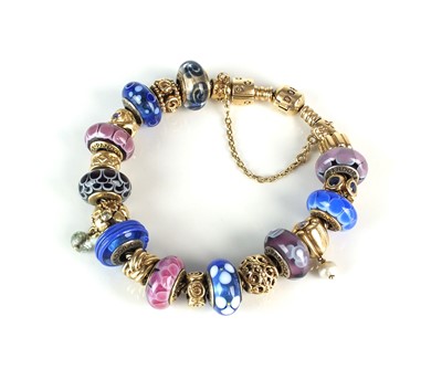 Lot 45 - A 14ct gold Pandora herringbone bracelet with twenty charms