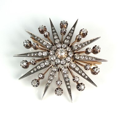 Lot 115 - A Victorian diamond star burst brooch pendant